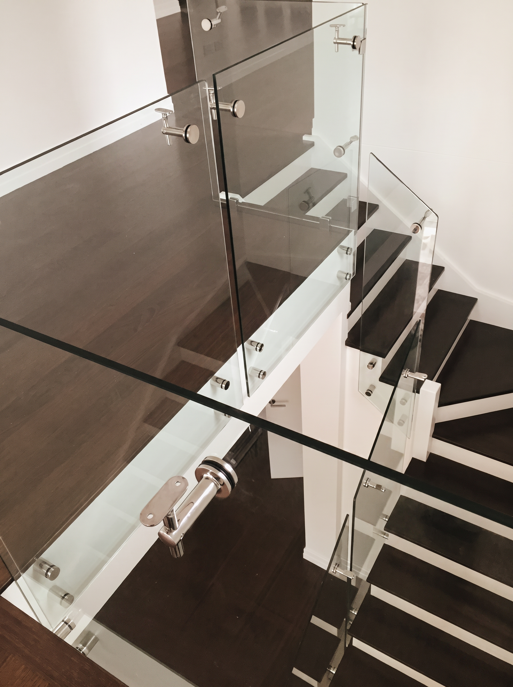 Stair Void Glazing — Frameless standoff balustrade · Void infill · Bespoke brackets